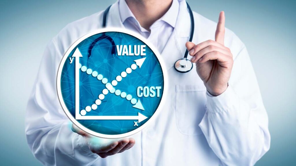 A doctor with their hand placed below a sign that indicates lowering costs and increased value on a graph.