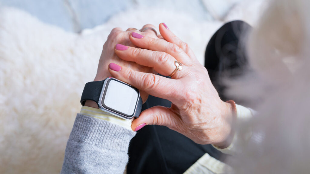 Woman uses her smartwatch to check her daily activities.